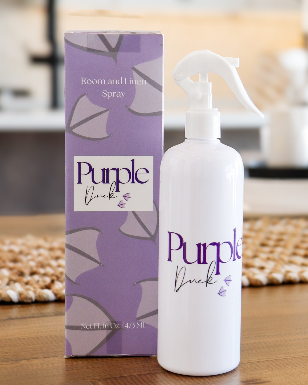 16 oz Room & linen Spray with the box next to it, in a kitchen