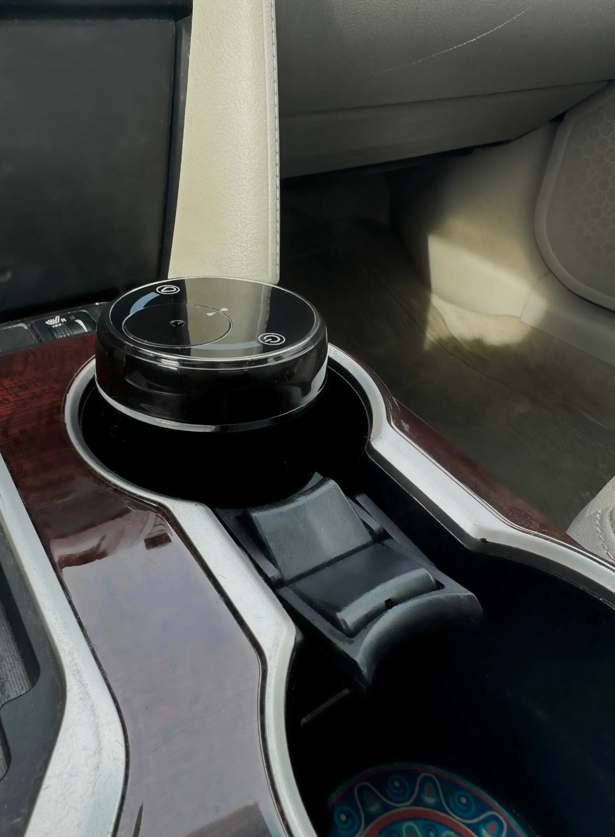 Mini, Car diffuser sitting in a cupholder, fully charged, ready to diffuse