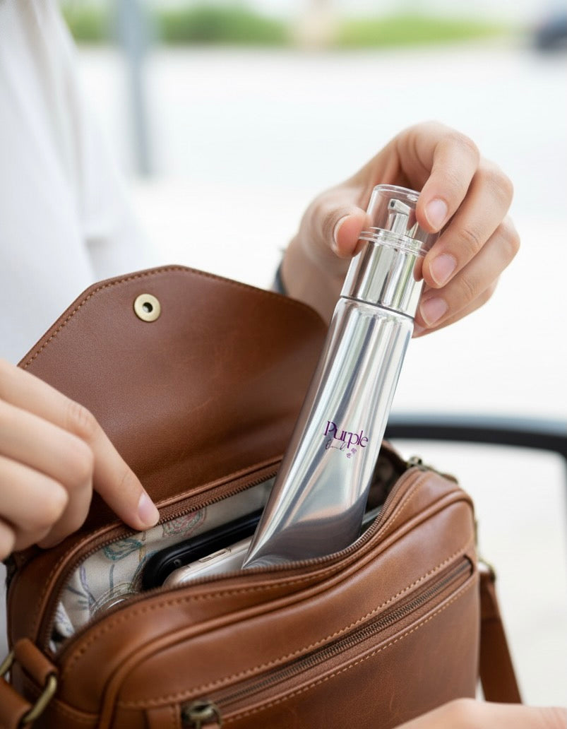 Person pulling out Purple Duck's Hand Lotion from a brown leather handbag