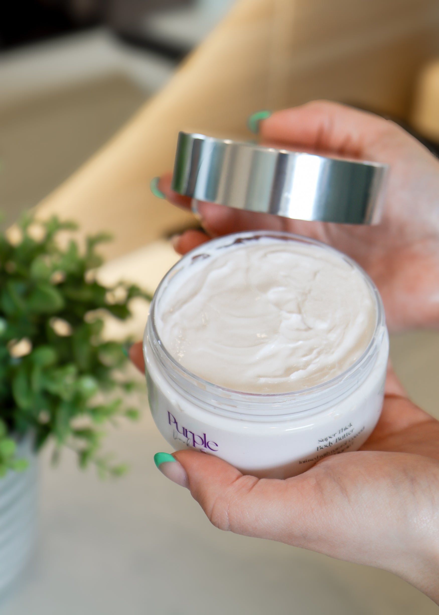 Close-up of Purple Duck cream container showing the white cream inside