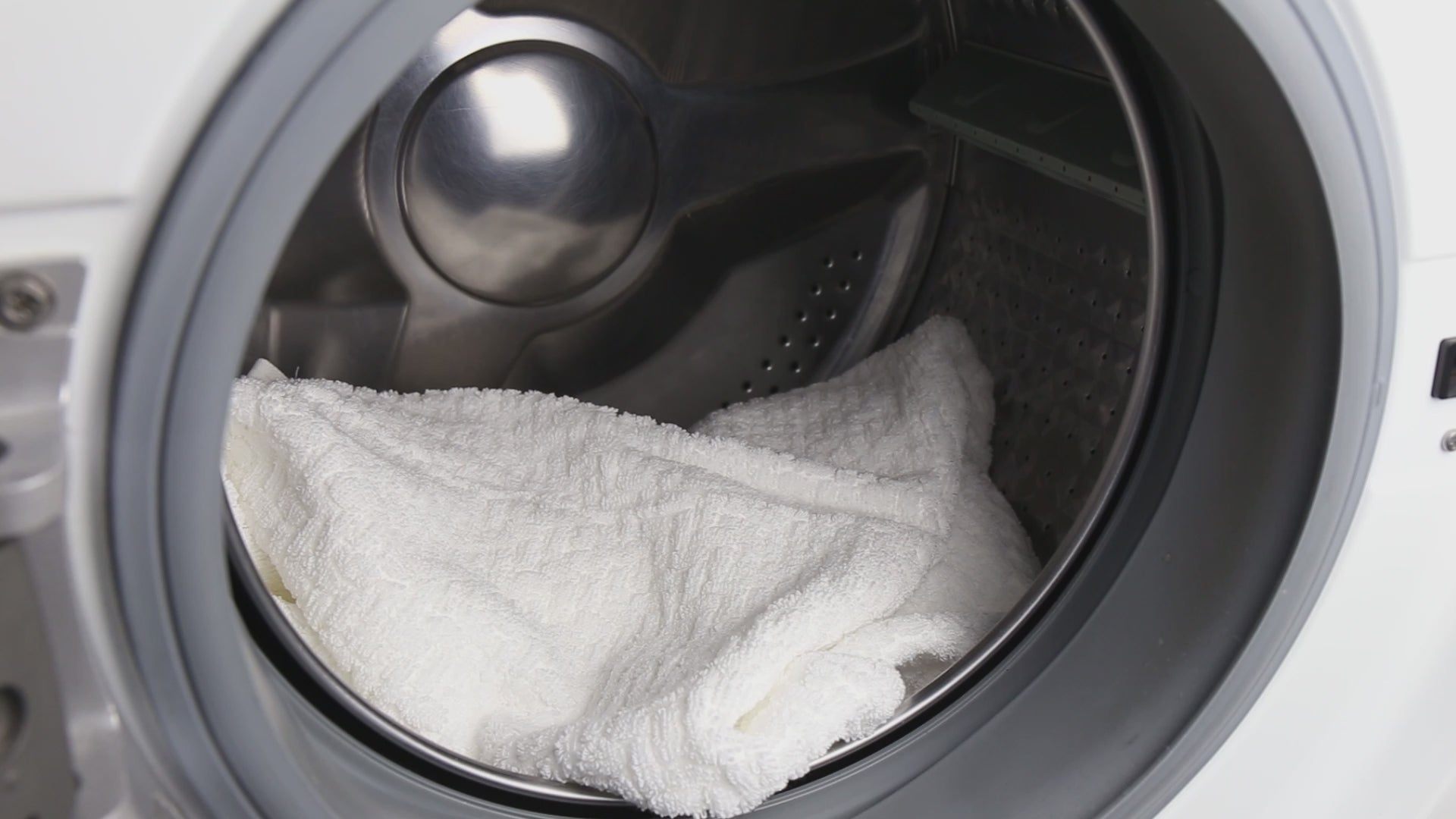 Load video: White towel inside the washing machine