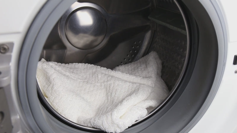 White towel inside the washing machine